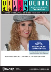 Una mujer pelirroja vestida de chulapa con una boina