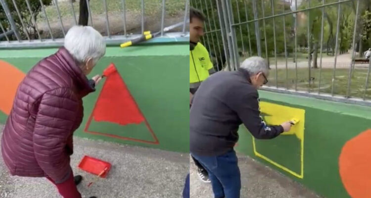 Participantes en la actividad pintan un muro en la Instalación Deportiva Básica Jazmín de Ciudad Lineal.